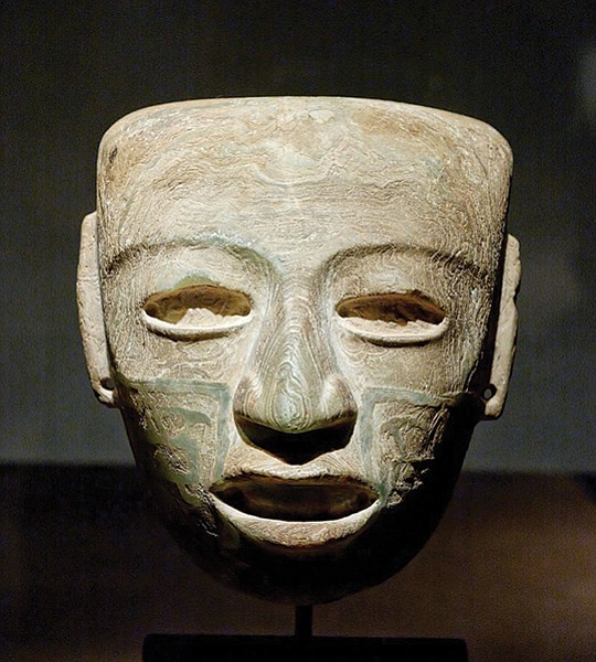 Most of the masks are carved from greenstone and polished to a glassy Brancusian sleekness.