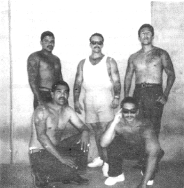 Sammy Santos, standing, left. One of the bullets pierced Santos’s heart and lung.