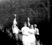 Ramey Creek. Seconds after this photo was taken, the preachers plunged the two young women under the slow-moving water.