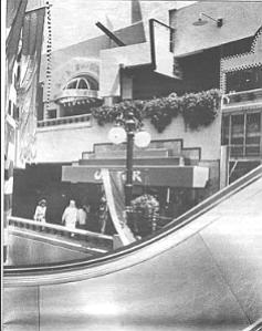Swift silver escalators, pitched at a steep angle climb to Level 3 for movies and food.
