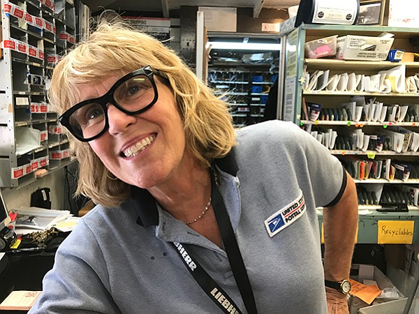 Postmistress Karen: big smiles in a tiny post office