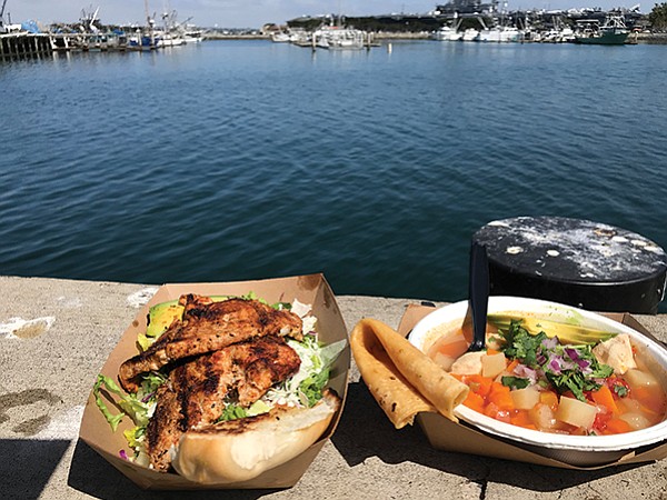 Lunch with a view: My thresher shark salad, and angel shark soup. USS midway in background