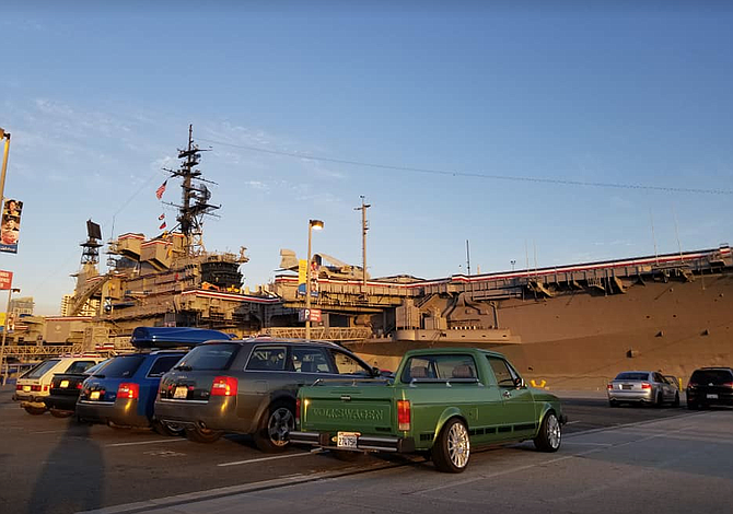The gray USS Midway is a “killer-backdrop.”
