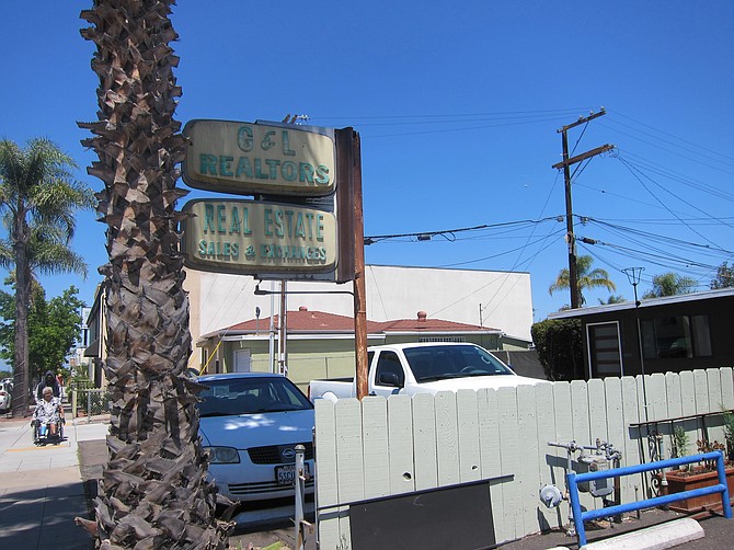 Donovan's University Heights office has relic signage from when former 1970s city councilmember Fredrick Schnaubelt hung his shingle there. 