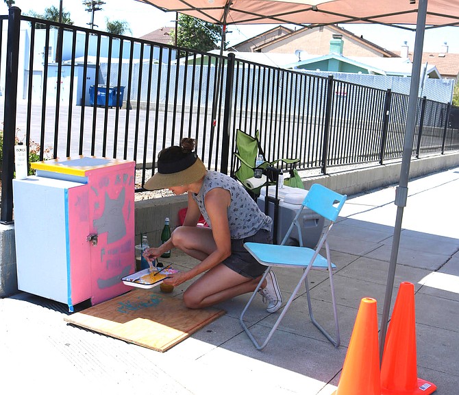 Janine Wareham at 34th and Adams: “I’m trying to paint a bunch of positive messages for the community,” 