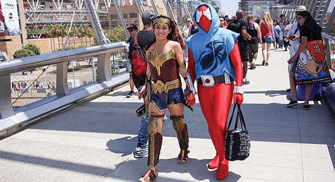Wonder Woman and Spiderman. “There are so many people here. I have to make sure that these kids and adults don’t run and clog up the pathways.” - Image by Andy Boyd