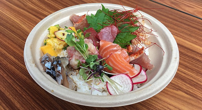 The Single Fin rice bowl eats like omakase sashimi and vegetables served on a bed of rice.