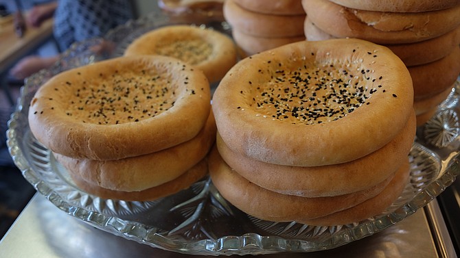 A stack of Uyghur nan, baked at Kroran Uyghur Cuisine