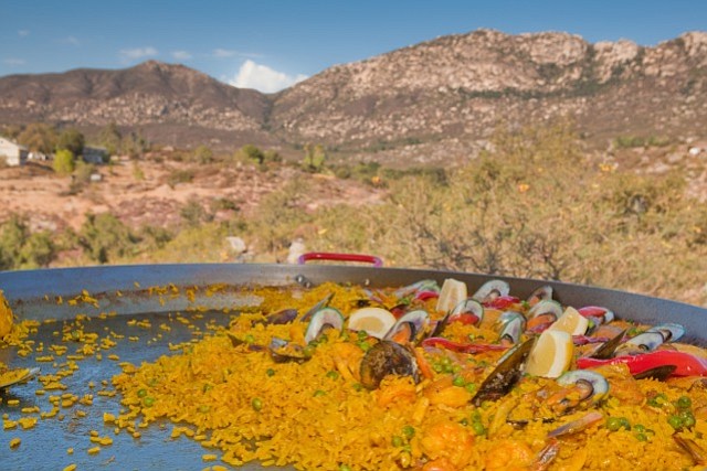 Paella and Rodriguez Mountain background