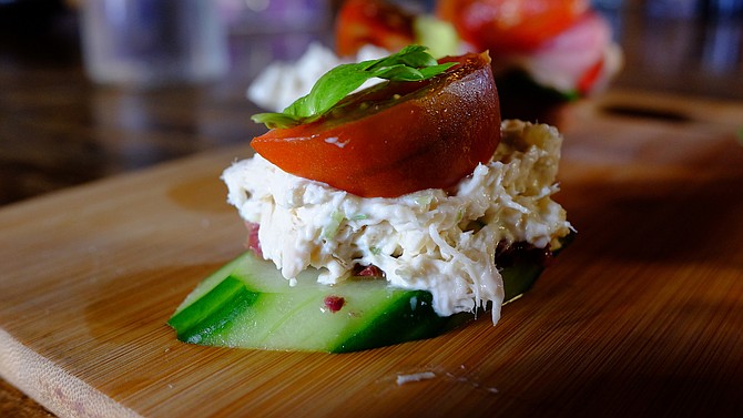 Tuna bites use cucumber slices as an alternative to a ciabatta roll.