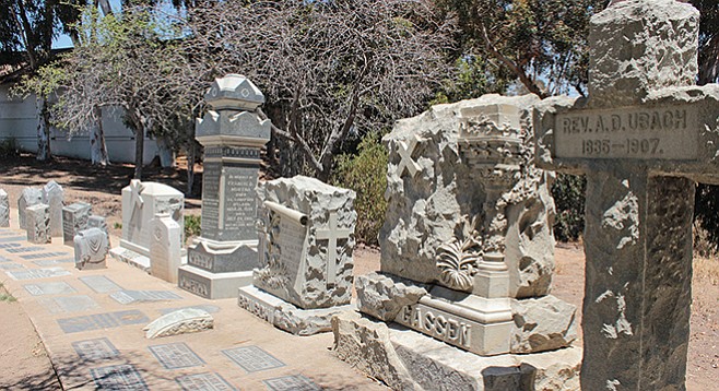 Bank of memorial tombstones in the southeast corner of the park