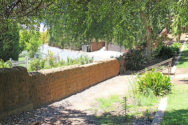 Old adobe wall and stairway along southern boundary