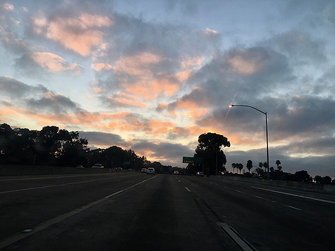 Sunrise over I-5 South near downtown San Diego and Balboa Park, August 31st, 2018.