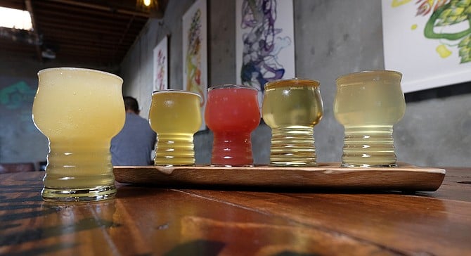 A cider slushie (left), along with a flight of very distinctive ciders