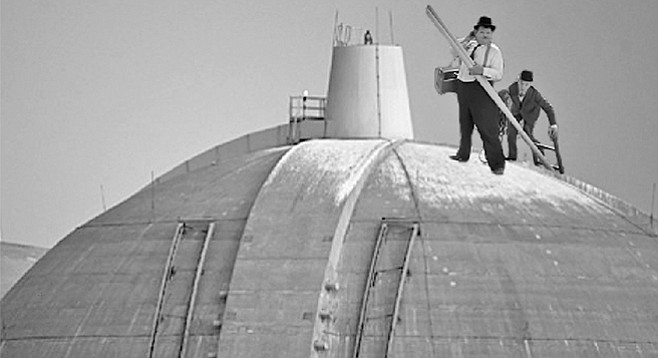 “All right, Ollie, let’s get this place ready for inspection, on the double!” In a recent file photo, San Onofre nuclear waste technicians Stan Laurel and Oliver Hardy prepare to begin their work atop one of the domes at the San Onofre nuclear waste facility. Upon being informed via megaphone that the domes were in no way involved with nuclear waste storage, Laurel turned to upbraid Hardy for making him climb the 200-foot ladder for nothing, but in the process, swung the pole he was carrying and knocked Hardy off-balance. Hardy then grabbed Laurel in an attempt to keep from falling, and the two wound up sliding down the face of the dome and crashing into a tenuously mounted spent-fuel canister below. Fortunately, when the canister rolled off its supports, it rolled onto the two inspectors, who cushioned its fall and prevented it from breaking. The inspectors sustained minor injuries, and are expected to resume their efforts post-haste. “As you can see, we take safety very seriously here at San Onofre,” said facility director Ray D’Ashun. “Just because we bought faulty equipment that led the the plant’s shutdown, and just because our parent company started the Thomas Fire through its own negligence, that’s no reason to suppose that the the commission will find anything amiss.”