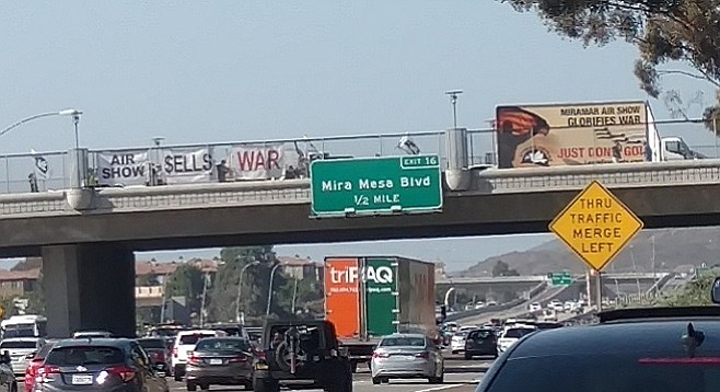 The billboard began slowly crossing the bridge, executing a U-turn, and repeating the process.