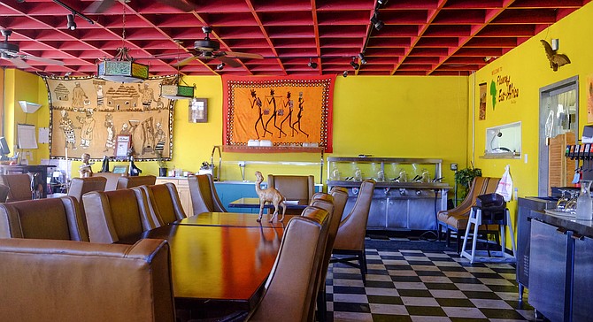 Saturated colors and African imagery add to the comfortable, welcoming space of Flavors of East Africa.