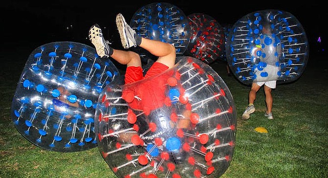 Players are wearing zorb balls, five feet in diameter.