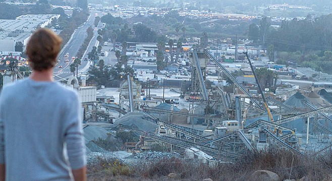 Neighbor looks down on Superior Ready Mix from hillside. Mission Gorge Road on left. - Image by Matthew Suárez