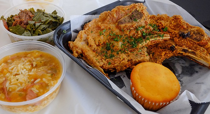 Fried pork chops with rice and gravy, collard greens, corn muffin, and poundcake