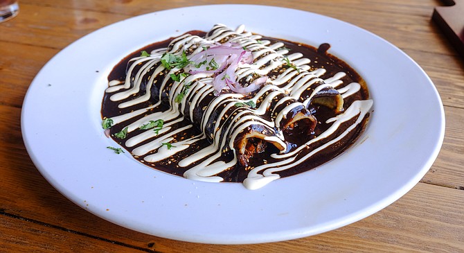 A plate of mole enchiladas, dressed to impress