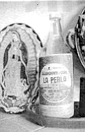 Aguardiente, the clear, strong cane liquor made at La Perla, a small factory just down the street from Teresa’s house