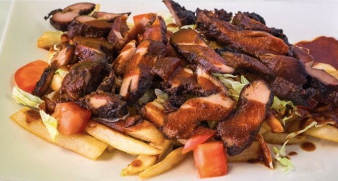 These jerk chicken fries shown on the Scoootr site look good, but you'll have to go to Laylah's to try them.
