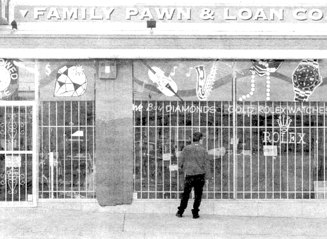 Police blocked the streets near Family Pawn and Loan shop and stormed in.
