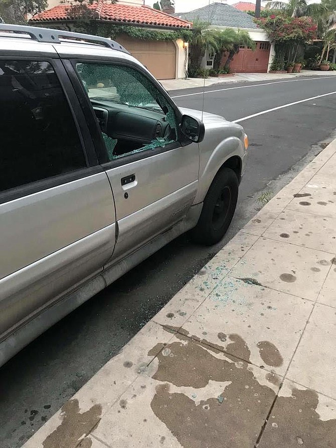 SUV with broken window.  “It happened last Friday (October 26) at 4:30 pm on Dolphin Place."