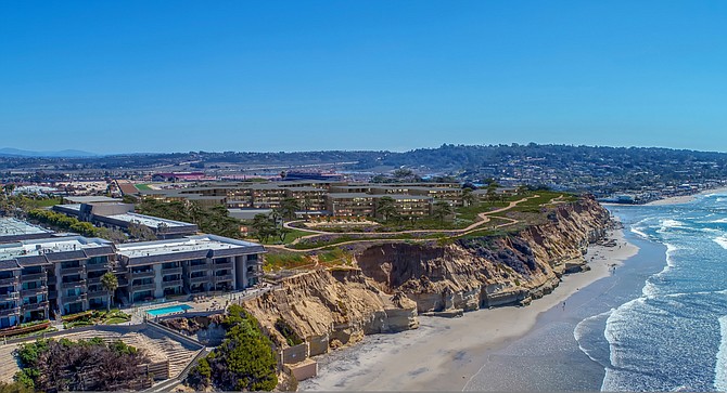 Solana Beach's Del Mar Beach Club residents say the proposed resort (to right in photo) will tower over their condominium complex (left in photo). (Zephyr)