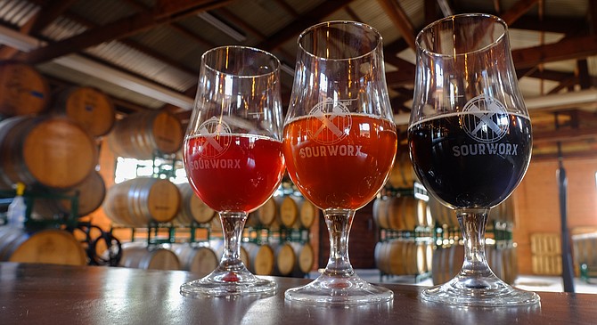 A red, golden (orange), and dark sour at Helix Brewing's new tasting room, Sourworx