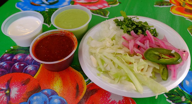 Gorditas Don Andres has a well equipped salsa bar and colorful tablecloths.