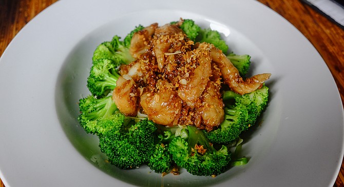 Steamed sole and broccoli quickly stir fried with garlic and pepper