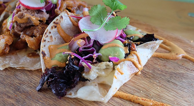 Hibiscus flower tops the list of veggies on this taco.