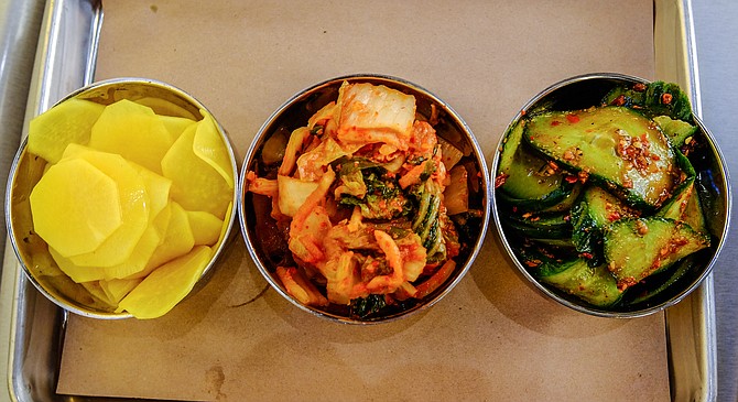 Banchan: turmeric pickled diakon radish, Napa cabbage kimchi, and sichuan cucumber