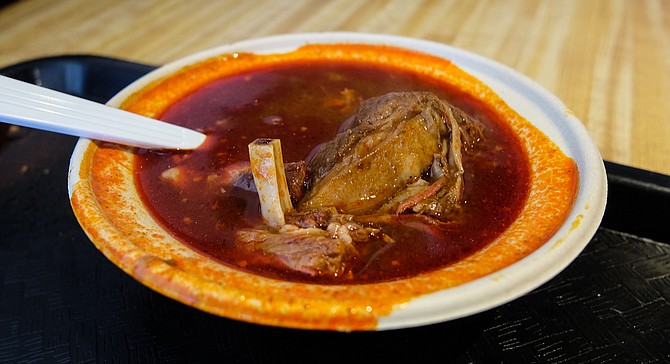 Goat meat and bones meet chili peppers in the warming Birria de Chevo soup.