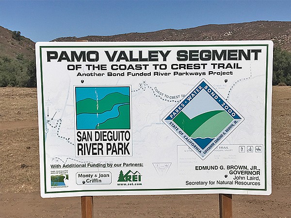 Sign announces new trail segment