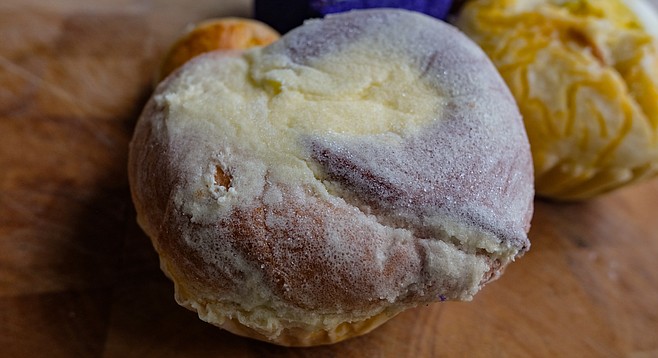 An ensaymada is a Filipino pastry similar to a danish.