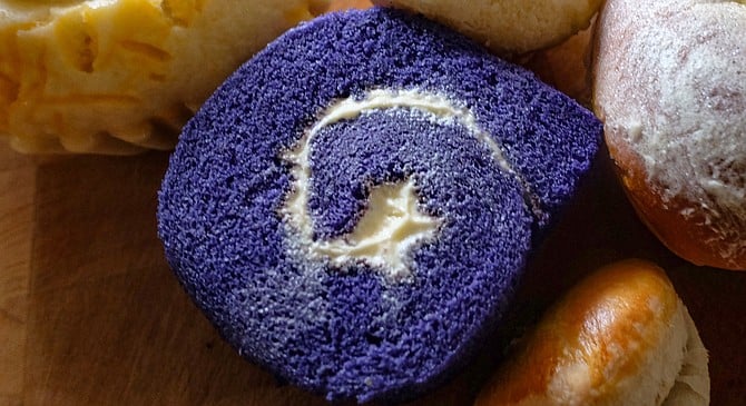 Purple indicates it's an ube cake roll.