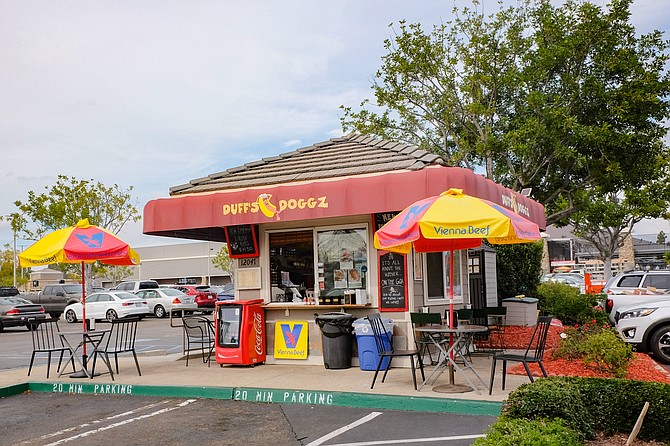 A Chicago style hot dog shack in a Home Depot parking lot