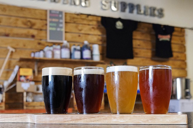 An Embarcadero Brewing flight: nitro stout, coffee brown ale, golden ale, and strawberry blonde.