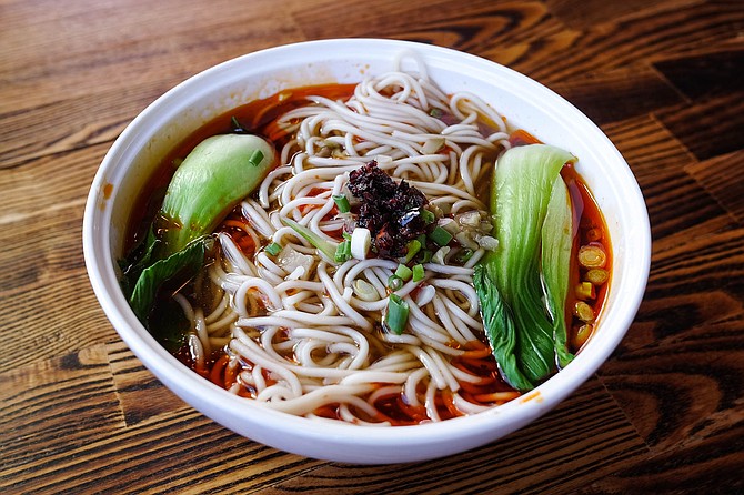 The red broth containing these noodles is not as flavorful and spicy as it looks.