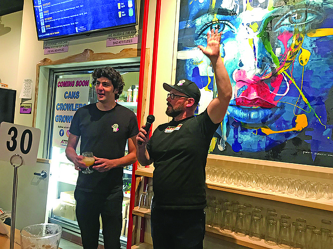 Kurt, with his Brazilian brewer Alvaro, responds to crowd. Paco’s $4,400 “Quetzal Urbana” painting shows a brewpub can also be a gallery