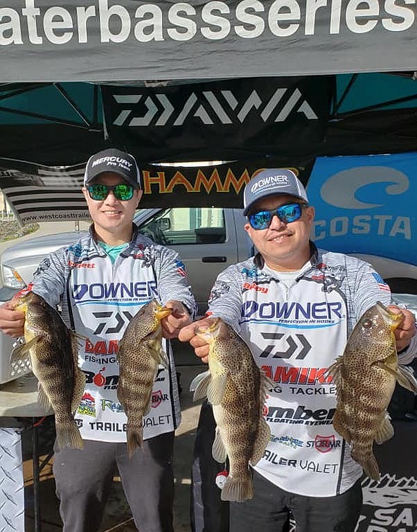 Garrett Ching and Bobby Martinez with spotted bay bass