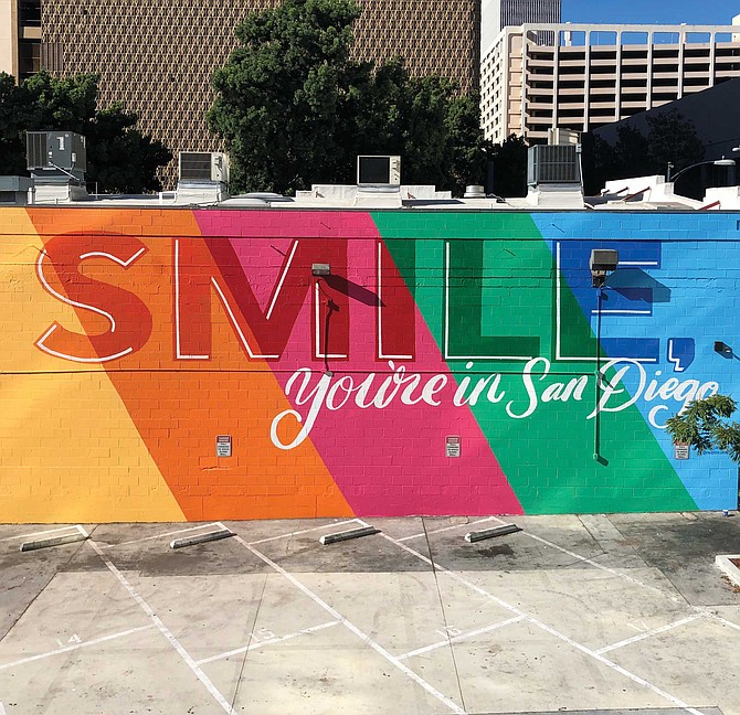 Phoebe Cornog is the creator of the Smile mural which is located on a large parking lot wall north of Broadway on First Avenue.