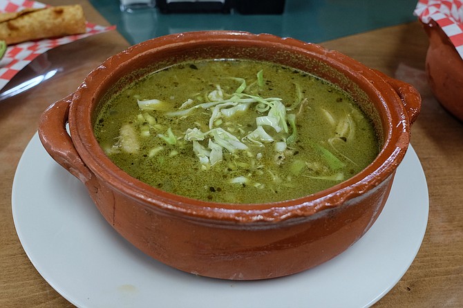 A bowl of warm pozole verde de pollo