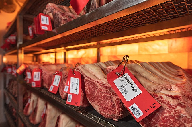 Primal cuts of beef spending time in climate controlled dry aging room