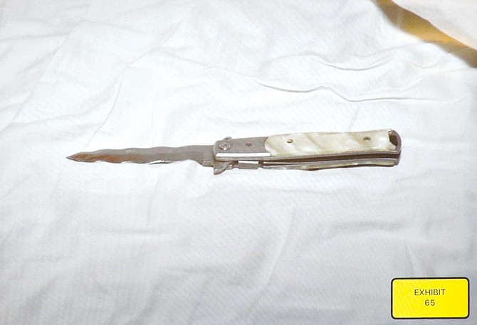 One deputy grabbed the knife and put it onto the bed in the room.
