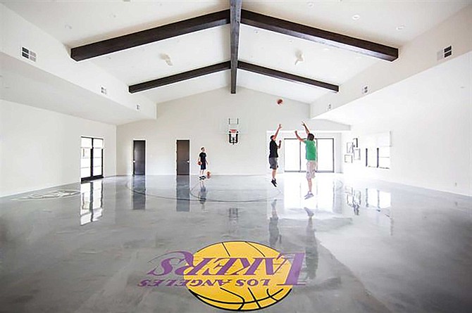 Forget a hoop above the garage with Run of the Knolls’ full-sized indoor court