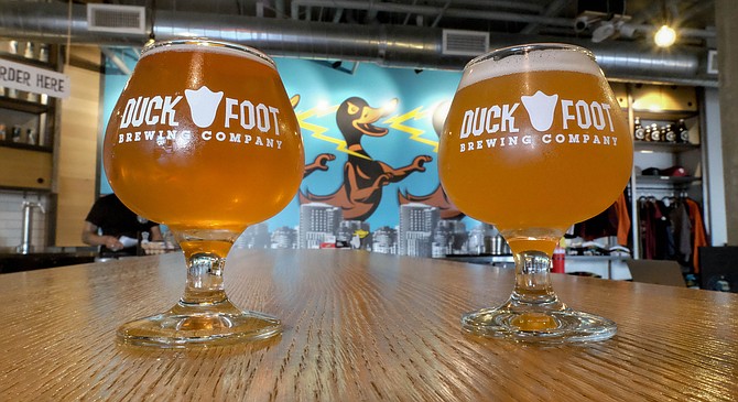 Beers and a wall of lightning spewing ducks at the Duck Foot tasting room